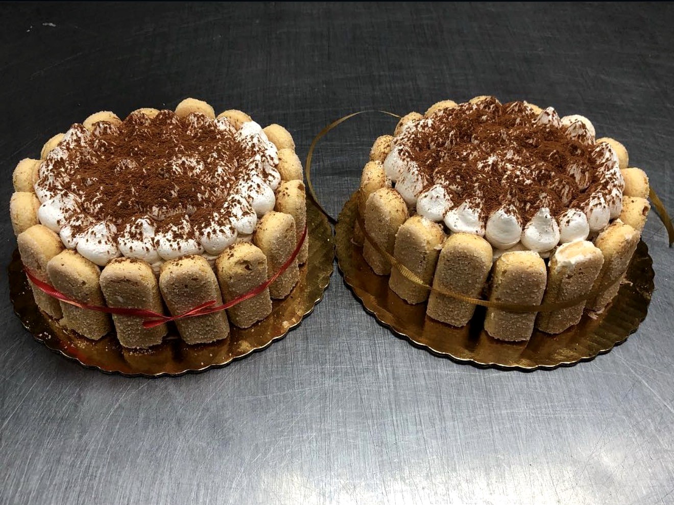 Two handmade tiramisu cakes with ladyfingers and cocoa dusting from Four Seasons Elmwood Park NJ